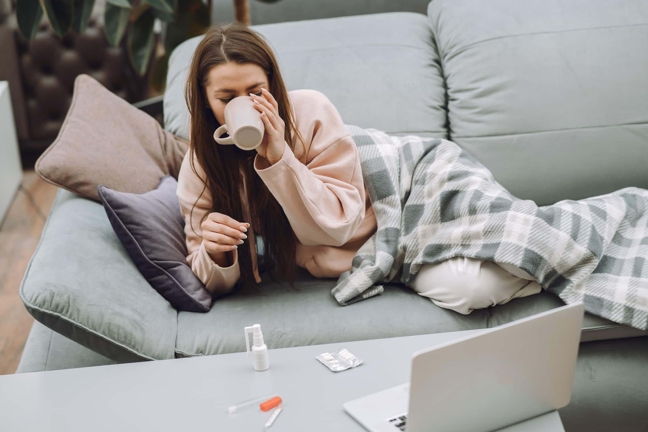 sick-woman-with-headache-sitting-home